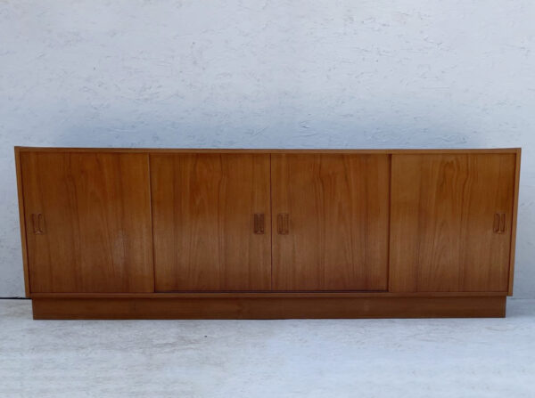 Mid Century Danish, Plinth Based Sideboard In Teak With Sliding Doors